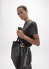 Shopper Efecto Piel Rayas Acolchadas y Detalle Bola Metálica Negro Lola Casademunt