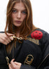 Bandolera media luna con solapa, asa corta trenzada y detalles metalicos NEGRO LF2504054.00N.U LOLA CASADEMUNT